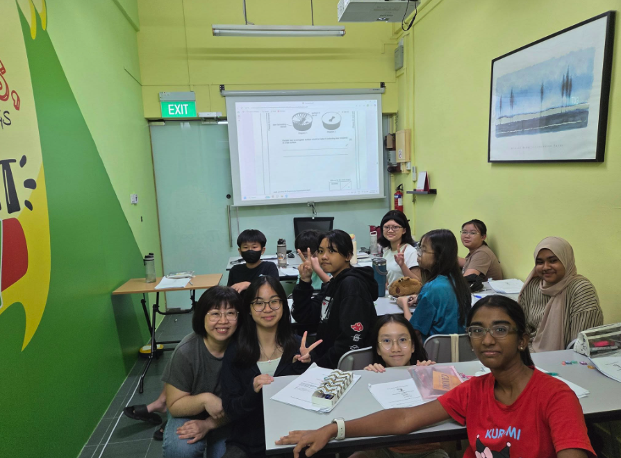 Teacher mentoring students at SL Education